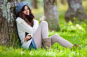 Woman sitting on meadow