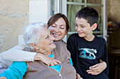 Elderly woman at home with her family