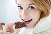 Woman eating hazelnut chocolate