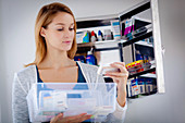 Woman sorting old medicines