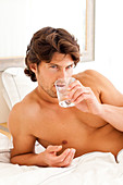 Man drinking glass of water