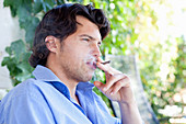 Man smoking cigarillo