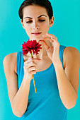 Woman plucking a flower