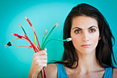 Woman holding Ethernet cables