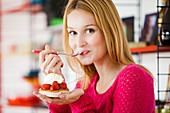 Woman eating pastry