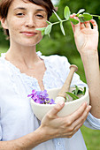 Woman picking plants