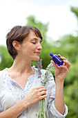 Woman inhaling the scent of lavender