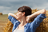 Woman stretching in a field