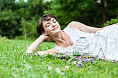 Woman relaxing on grass