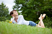Woman relaxing on grass