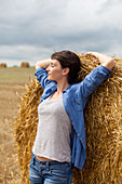 Woman stretching in a field