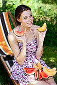 Woman eating watermelon and melon