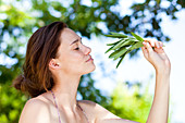 Woman picking sage from the garden