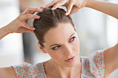 Woman massaging her scalp