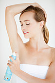 Woman using a deodorant