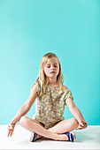 Child practicing yoga