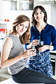 Women drinking red wine