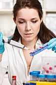 Woman working in microbiology laboratory