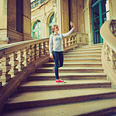 Young woman taking photo of herself