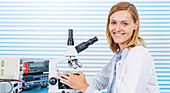 Portrait of woman with microscope