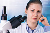 Portrait of woman with microscope