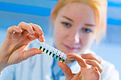 Young woman holding pcr tubes
