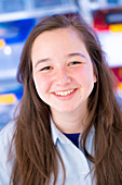 Portrait of girl with long brown hair, smiling