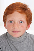 Portrait of a boy with red hair