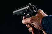 Person holding handgun