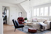 Various upholstered furnishings in living room of period apartment