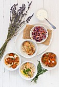 Bowl food, including chicken, Indian food and salads