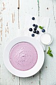 Sweet blueberry soup with cream