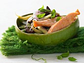 Salmon on a colourful bean salad with dried tomatoes