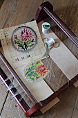Bead loom, colourful floral beading pattern and beading utensils