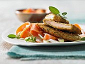 Chicken slices with a herb crust and aniseed carrots