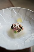 Halibut, oyster pearls, peas, wasabi, pork knuckle stock and elderflower vinegar jelly from the restaurant 'The Table' in Hamburg, Germany