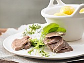 Boiled veal tongue with quark and potatoes