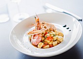 Gnocchi in fish sauce with scampi and prawns