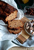 A sliced fruit loaf on a wooden board