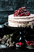 Semi-naked cake with currants and raspberries