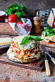 Pancakes baked as lasagna and topped with basil