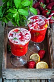 Strawberry lemonade in two glasses with straws