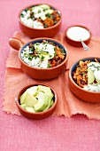 Chili con carne with rice and avocado