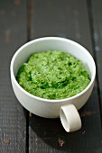 Homemade broccoli and spinach pesto in a cup
