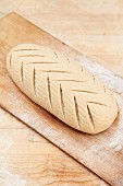 Decorative scoring pattern on the surface of bread dough