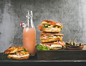 Bagels with salmon, eggs, vegetables, capers and cream-cheese and bottle of grapefruit lemonade