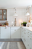 White country-house kitchen with natural accessories