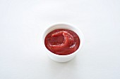 Ketchup in a styrofoam bowl