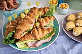Savoury croissants with ham and grapes for a maritime themed party