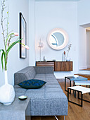 Scandinavian designer furniture in living room with wooden floor